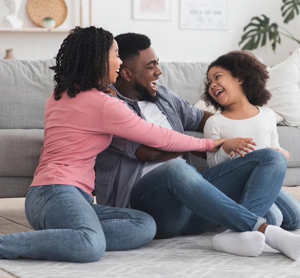 Cheerful black family having fun at home 1