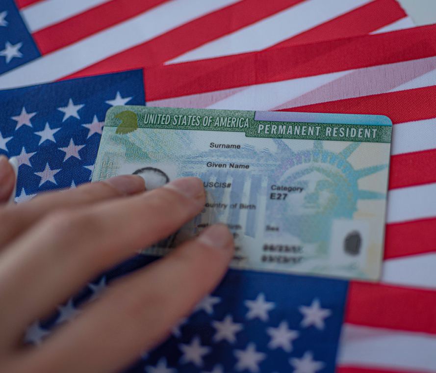 green card against american flag