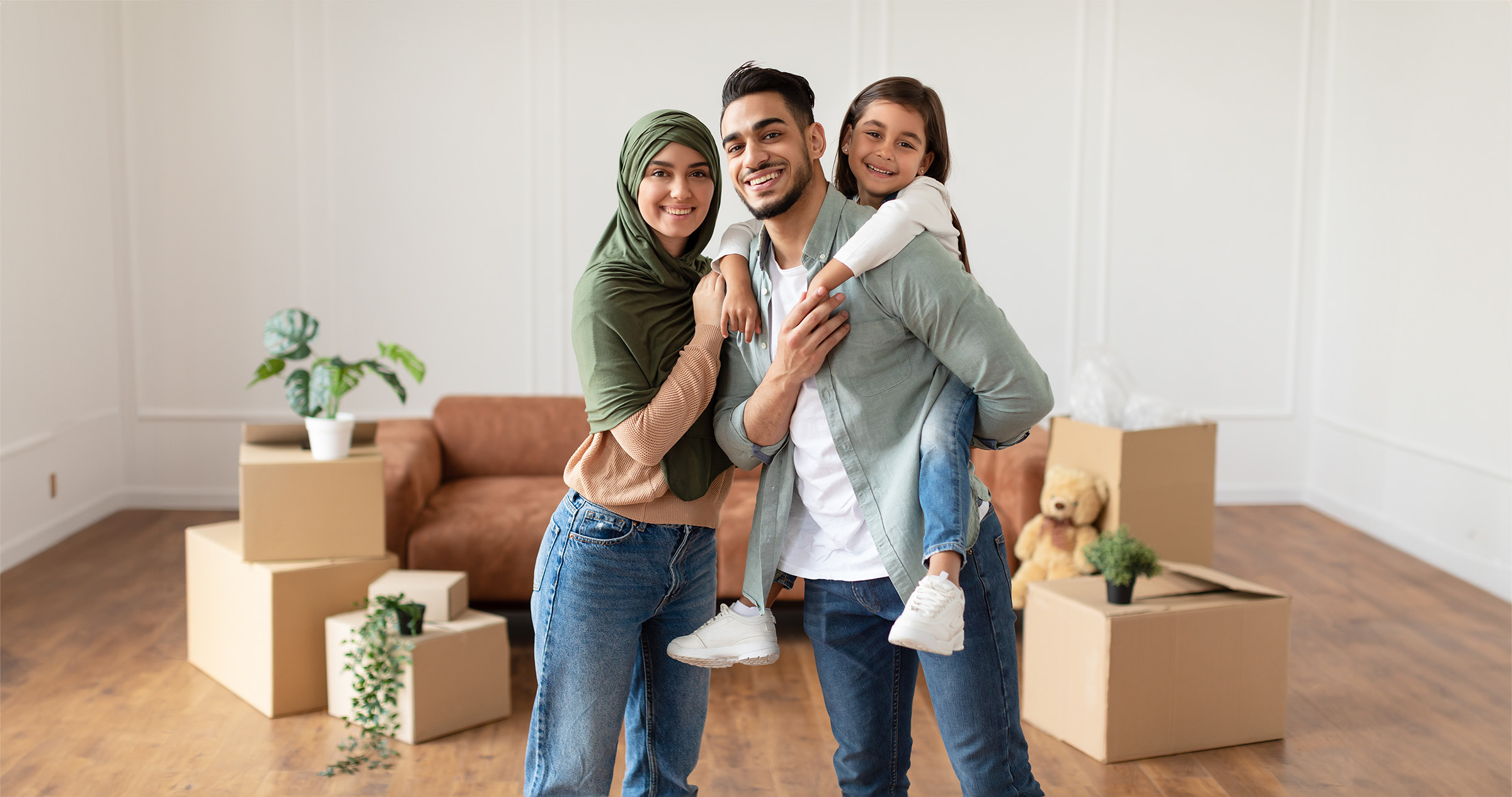 happy muslim family looking at camera