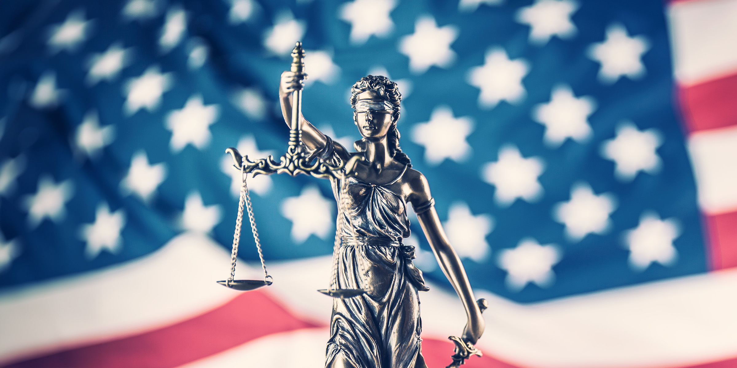 lady justice and american flag