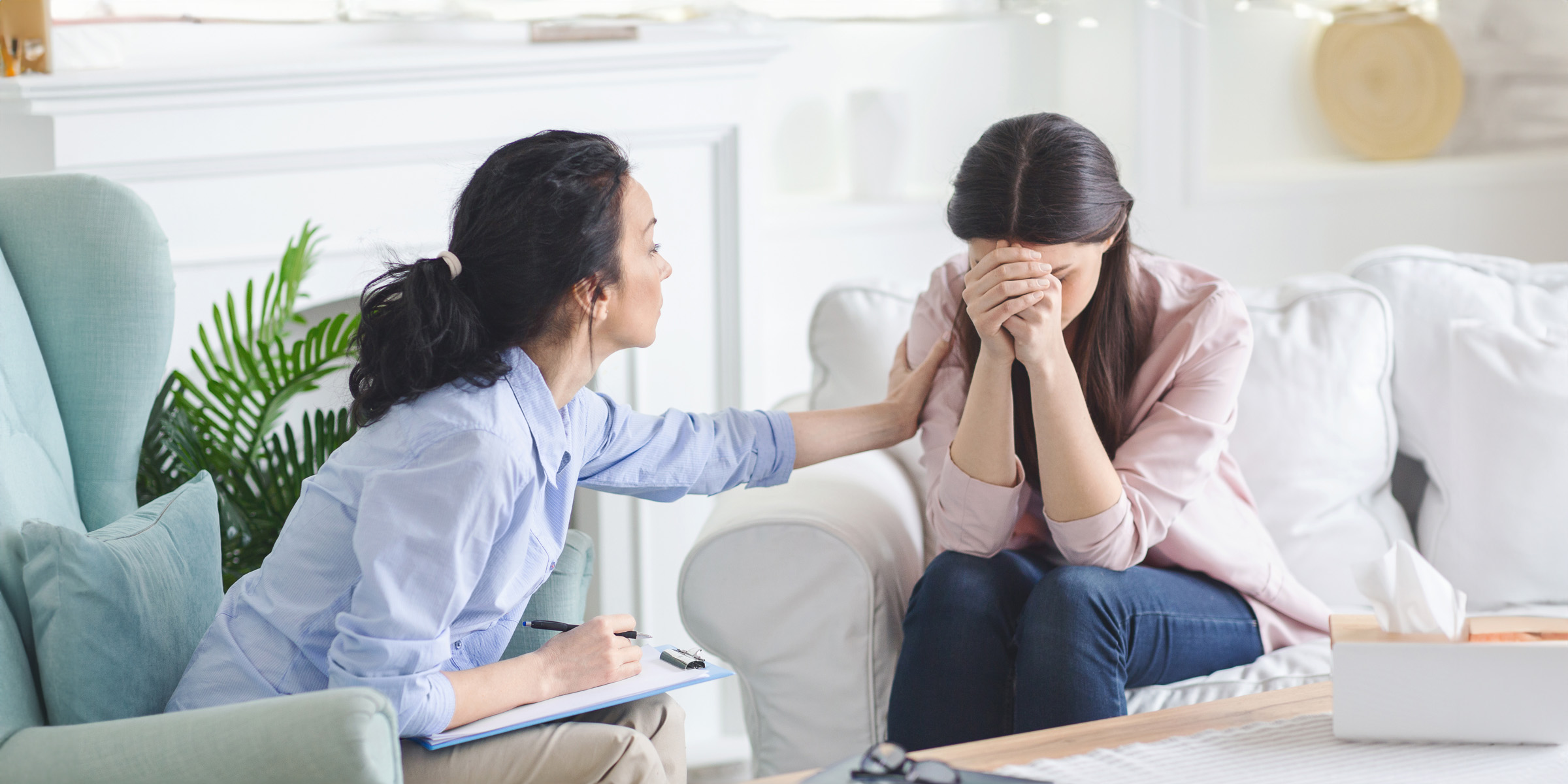 young upset woman crying at therapist session