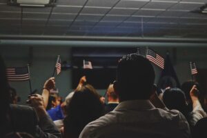 crowd holding American flags