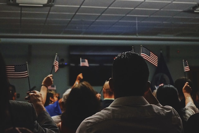 crowd holding American flags