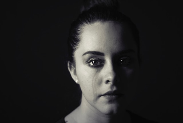 black and white portrait of woman crying