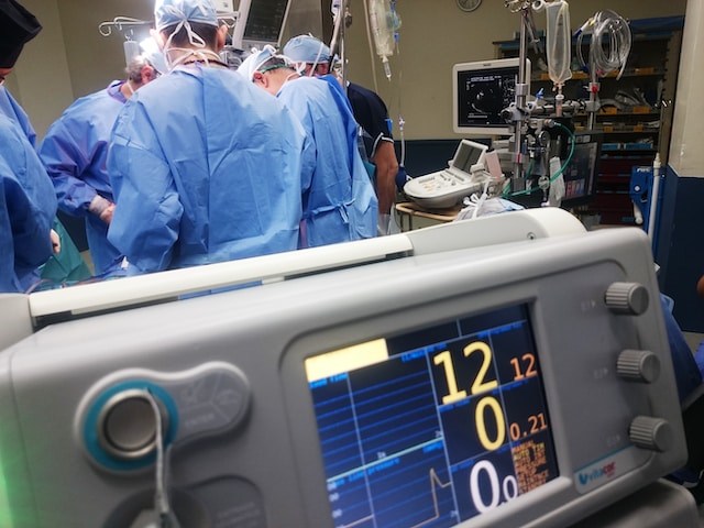 doctors around a table and medical equipment