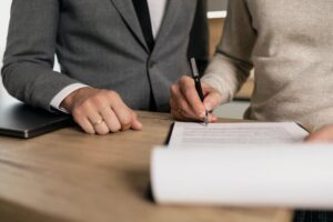 two people looking at paperwork