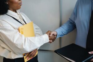 man and woman shaking hands