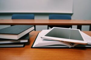 textbooks and tablet on desk