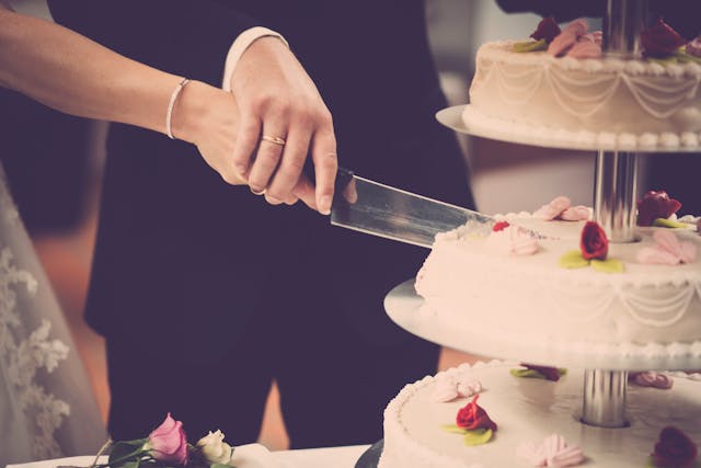 couple cutting wedding cake
